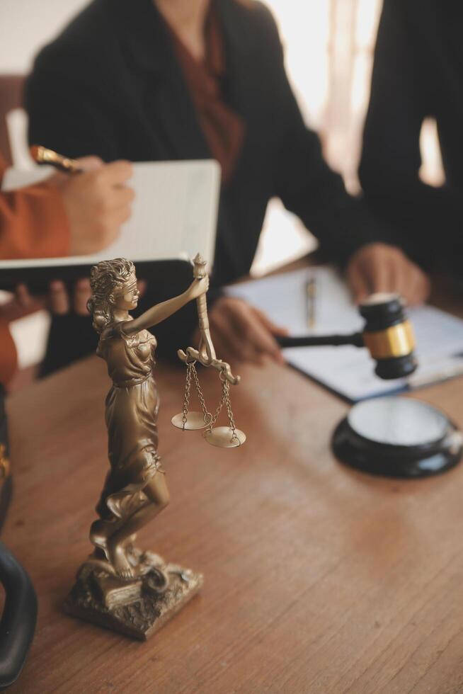 Lawyer, legal advisor, businessman brainstorming information on agreement details Business contracts in legal processing books for accuracy in contract documents. joint financial investment. photo