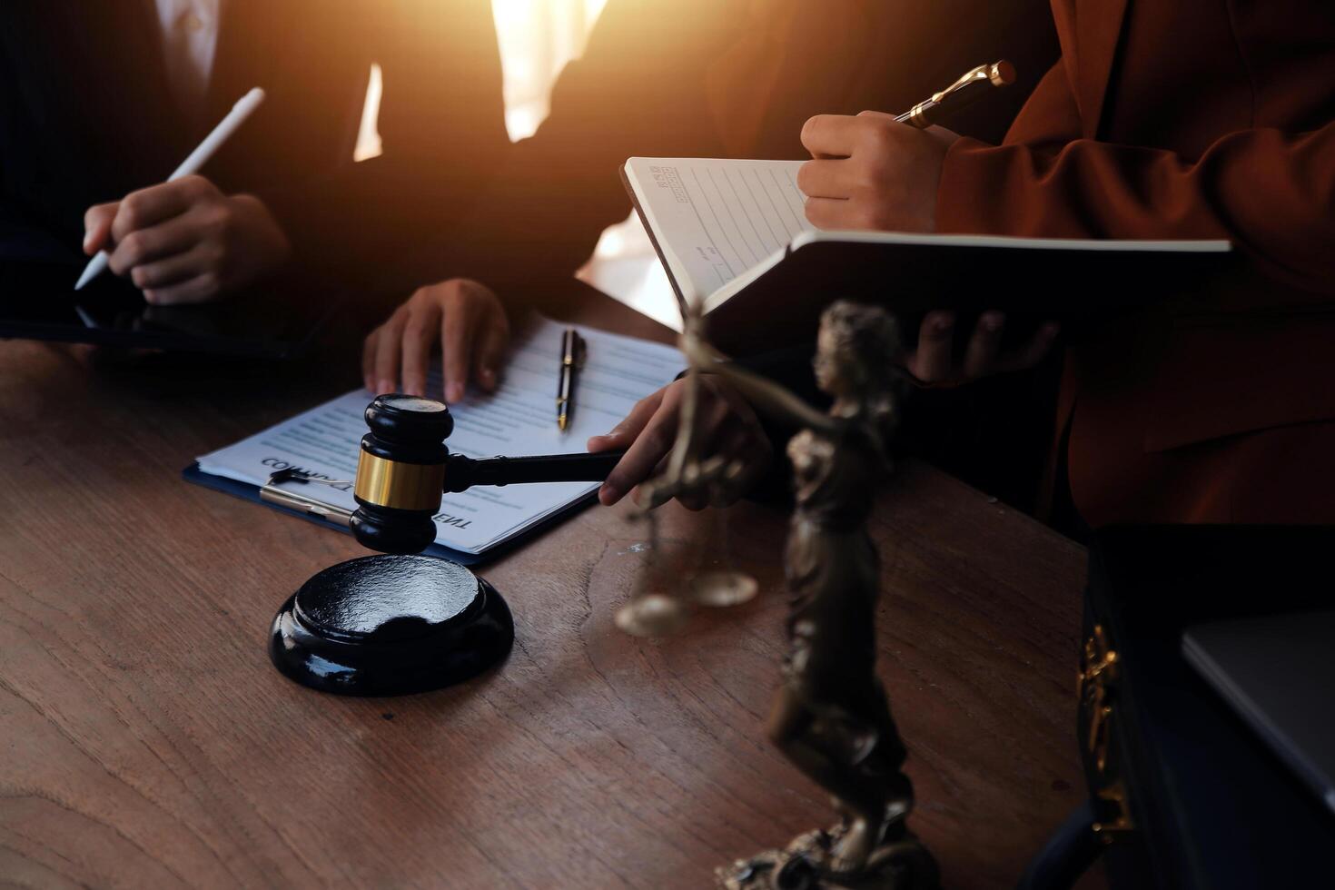 Lawyer, legal advisor, businessman brainstorming information on agreement details Business contracts in legal processing books for accuracy in contract documents. joint financial investment. photo