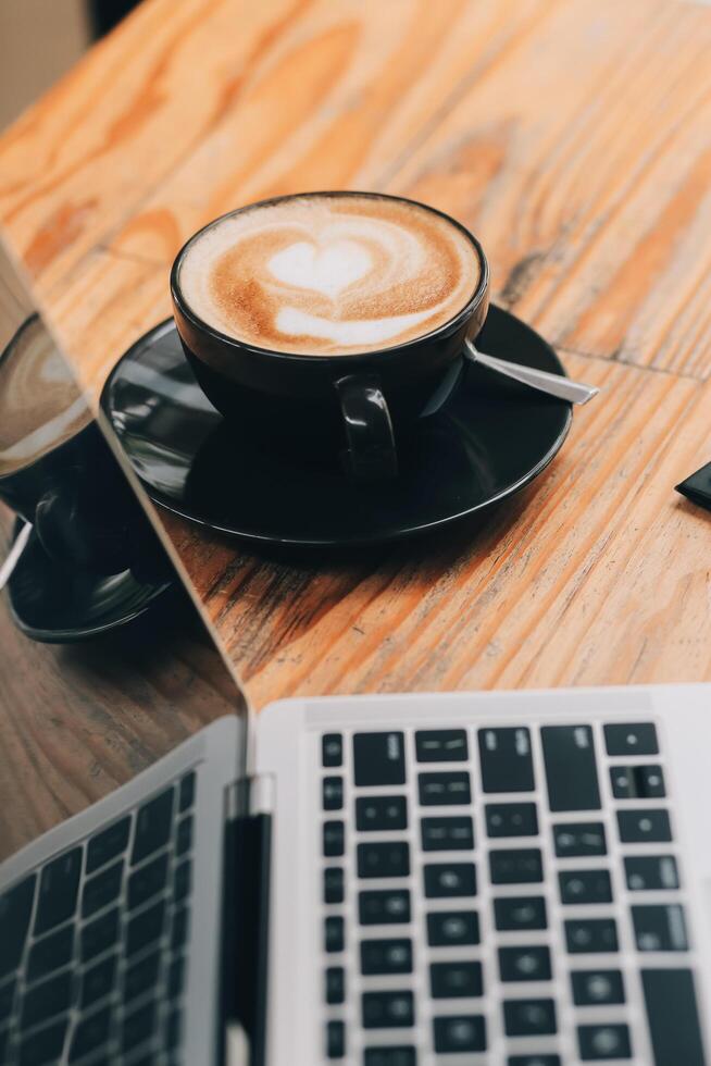 Closeup of coffee cup on table in empty corporate conference room before business meeting in office photo