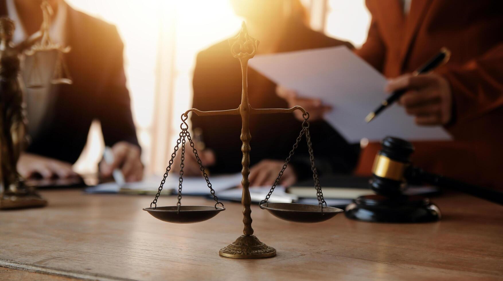 Lawyer, legal advisor, businessman brainstorming information on agreement details Business contracts in legal processing books for accuracy in contract documents. joint financial investment. photo