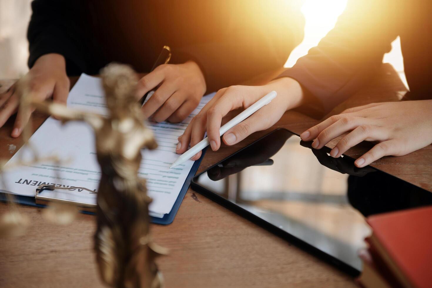 Lawyer, legal advisor, businessman brainstorming information on agreement details Business contracts in legal processing books for accuracy in contract documents. joint financial investment. photo