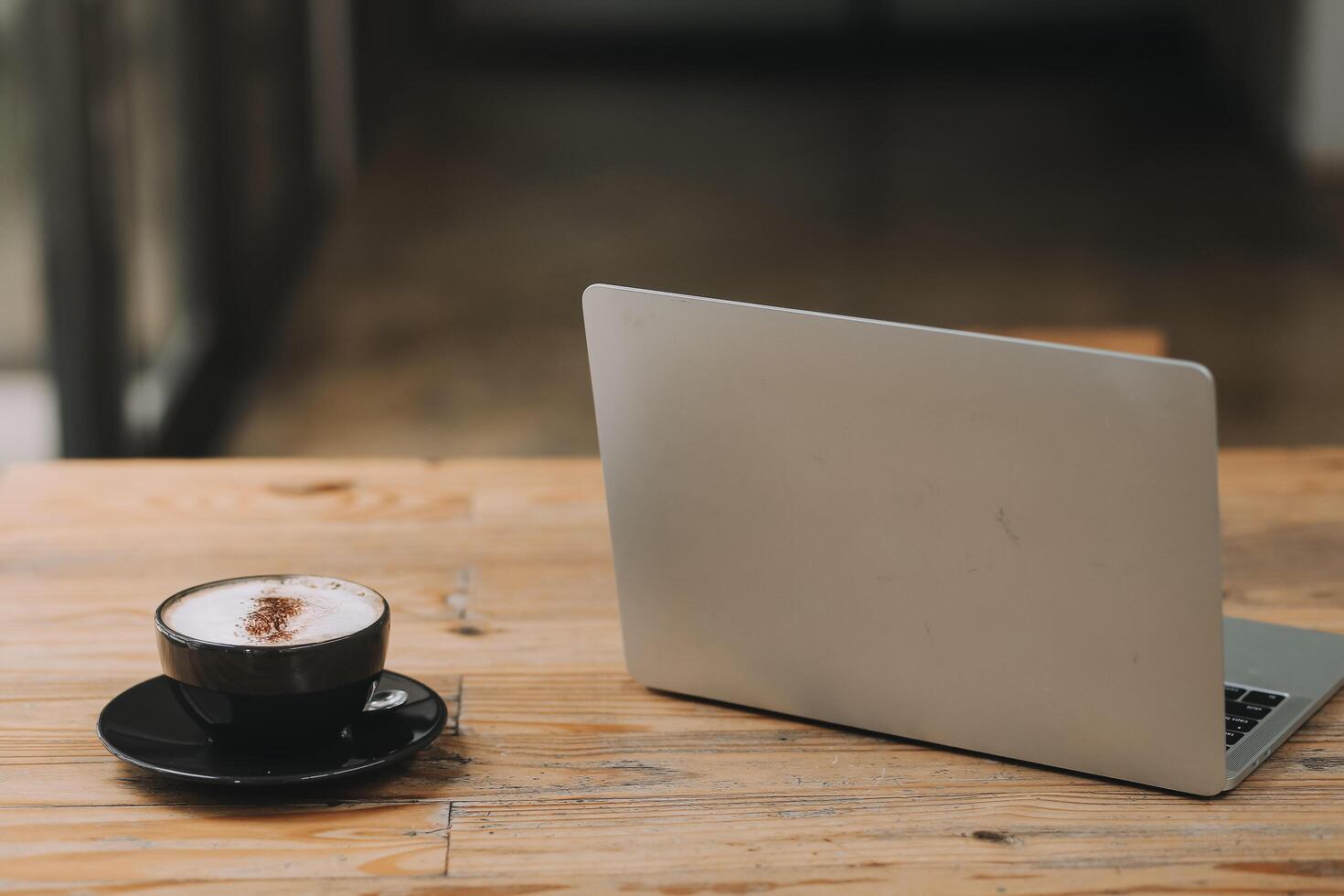 Closeup of coffee cup on table in empty corporate conference room before business meeting in office photo