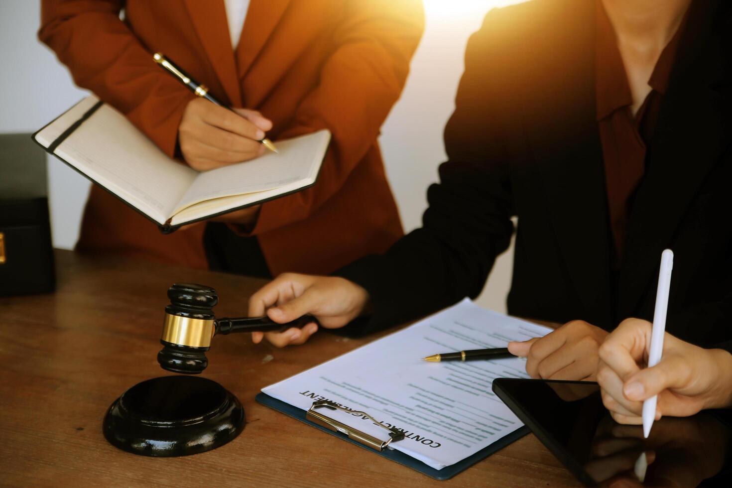 Lawyer, legal advisor, businessman brainstorming information on agreement details Business contracts in legal processing books for accuracy in contract documents. joint financial investment. photo