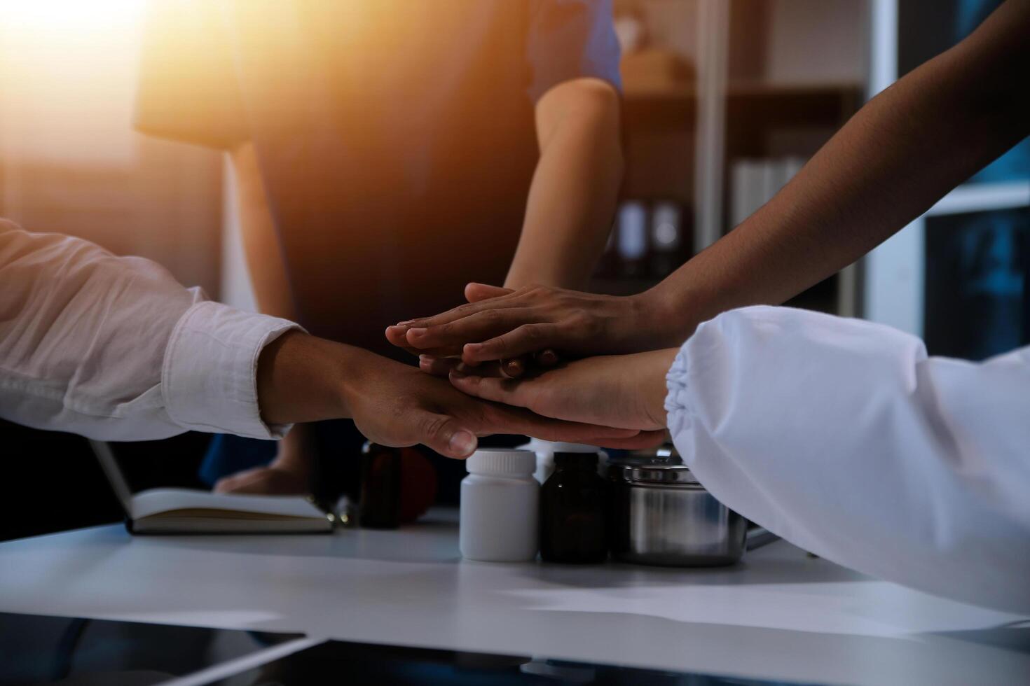 Doctor handshake and partnership in healthcare, medicine or trust for collaboration, unity or support.Team of medical experts shaking hands in teamwork for or success in hospital photo