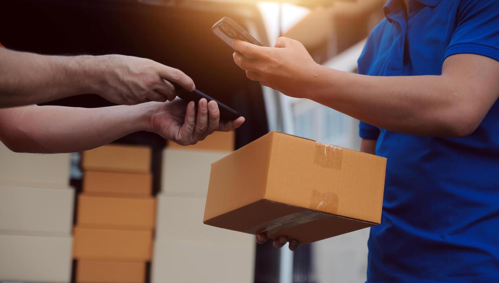 Asian delivery express courier young man use giving boxes to woman customer he wearing protective face mask at front home photo