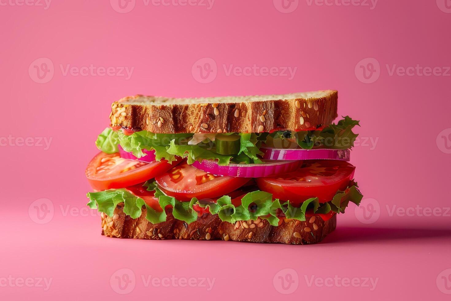 Tasty sandwich with lettuce, tomato and onion on pink background photo