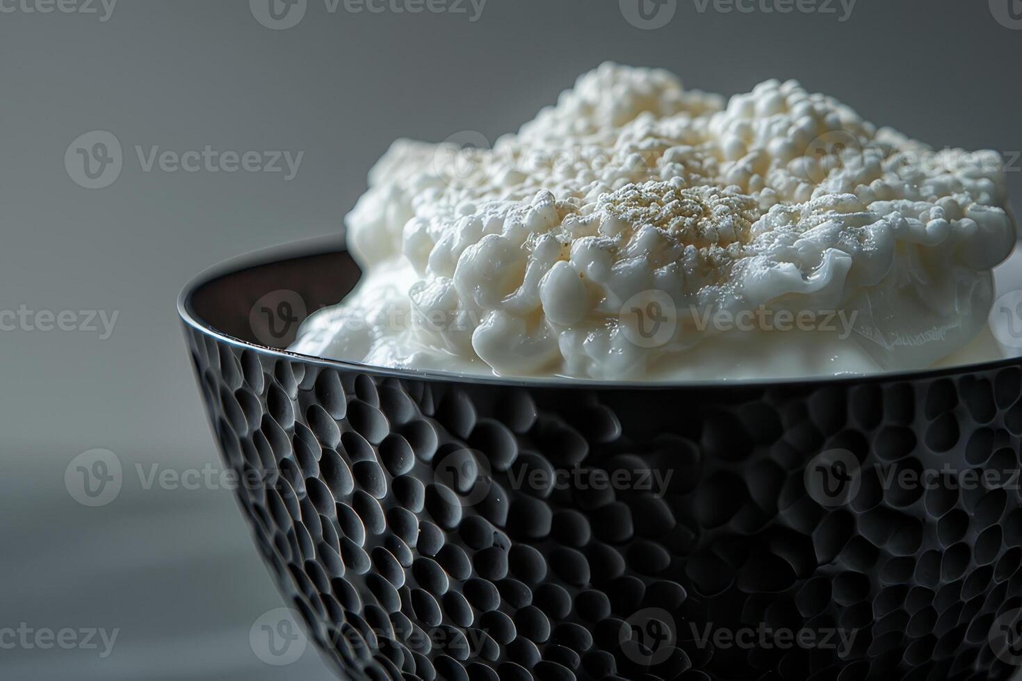 Cup of Bingsu. Cottage cheese in a bowl on a dark background photo