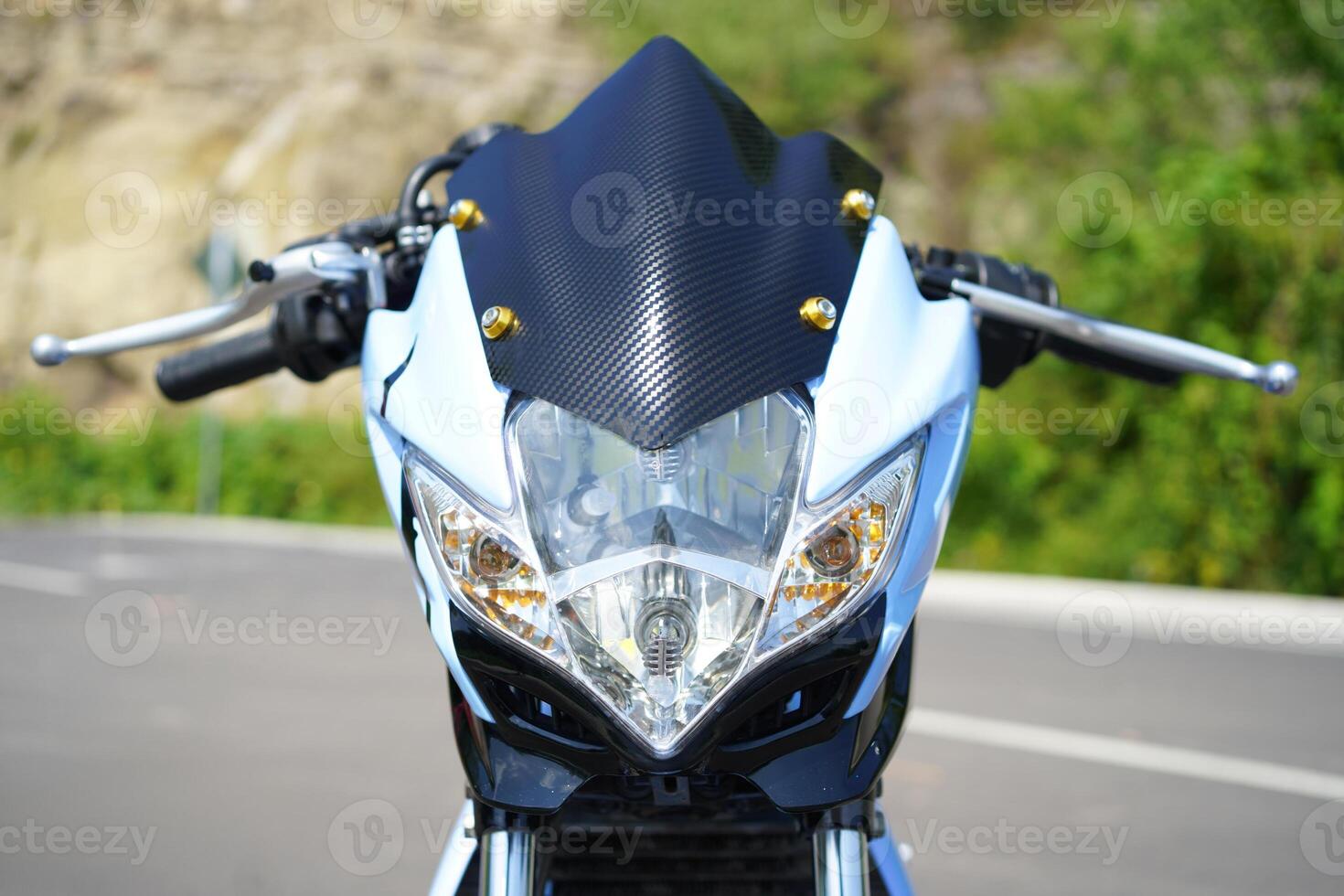 closeup, 4-Stroke underbone motorcycle headlight photo