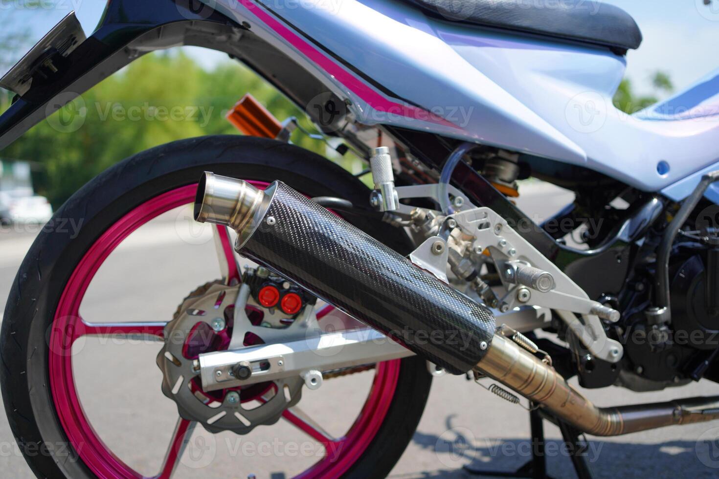 closeup, 4-Stroke underbone motorcycle racing exhaust photo