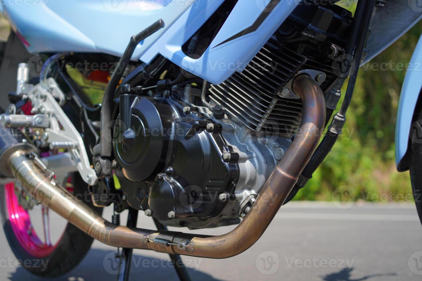 close up of a 4-Stroke underbone category motorbike engine photo
