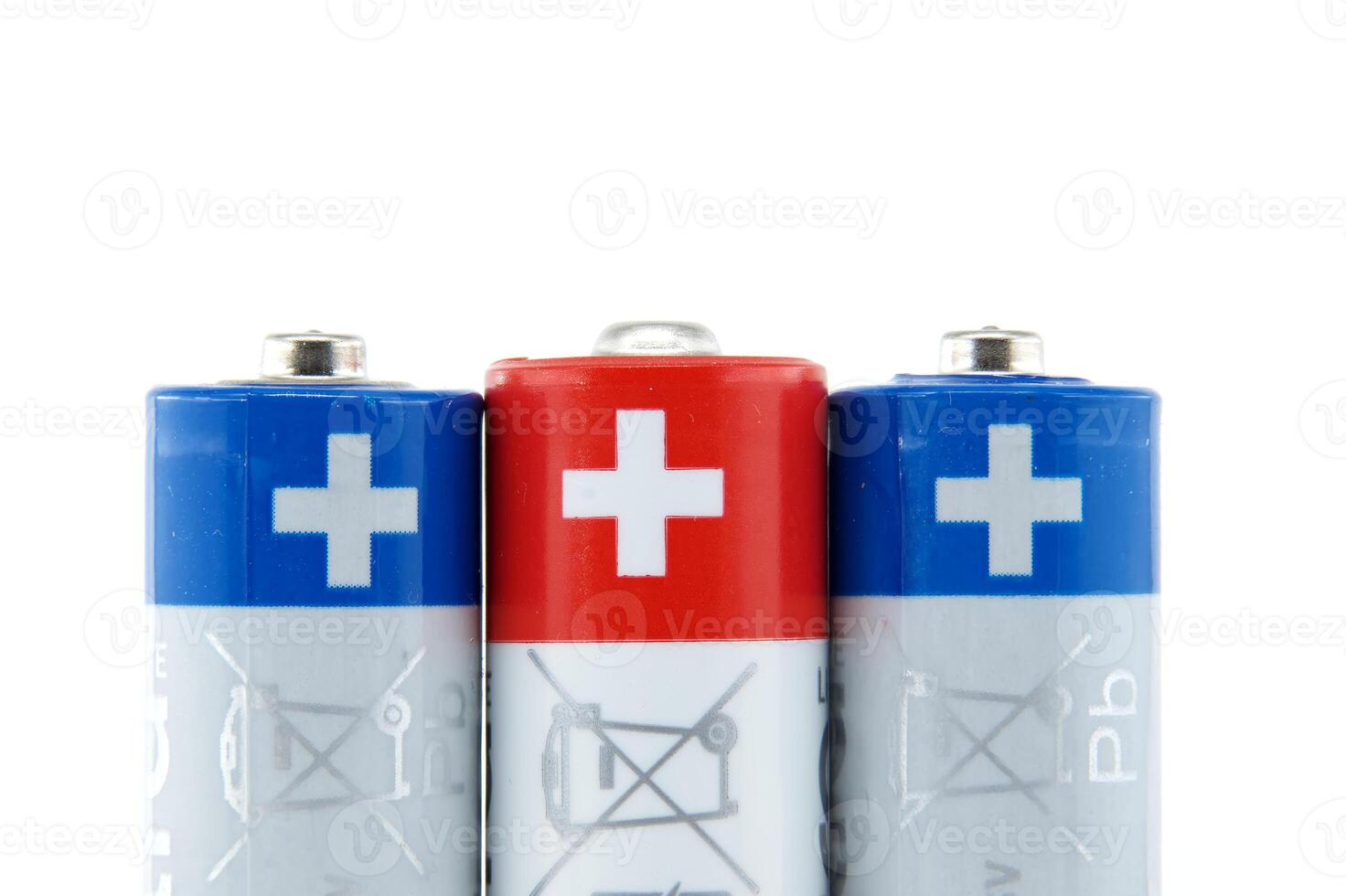 Close-up of AA batteries showing the positive terminals photo