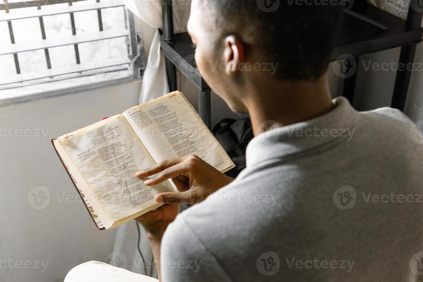 Man relaxing and reading a book. photo