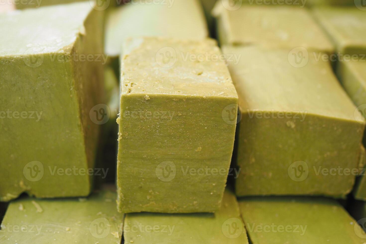 green color natural soap bar on table photo
