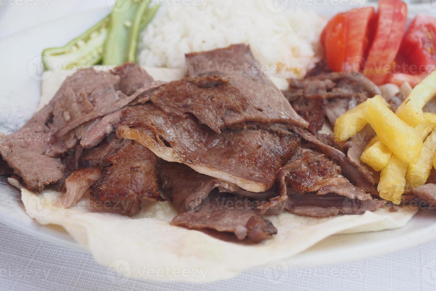 Tasty Doner Kebab with fresh vegetables, rice a delightful meal for lunch or dinner photo
