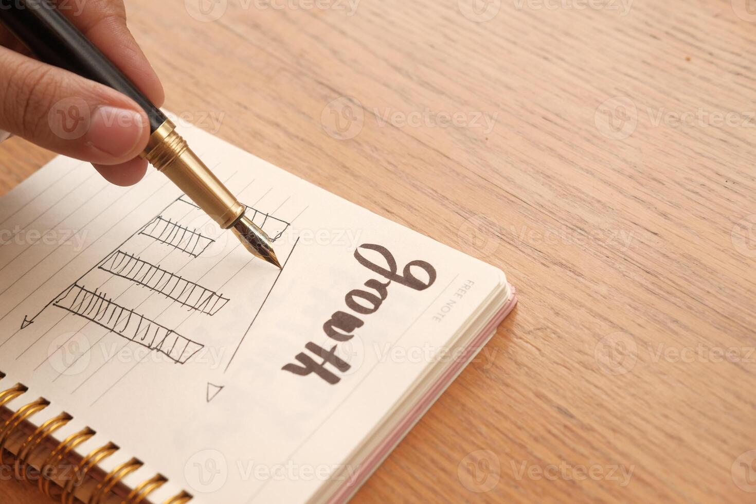 women analyzing growth chart on notepad indoor photo