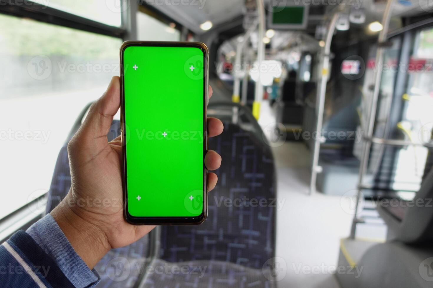 passenger sitting in a bus using his phone. photo