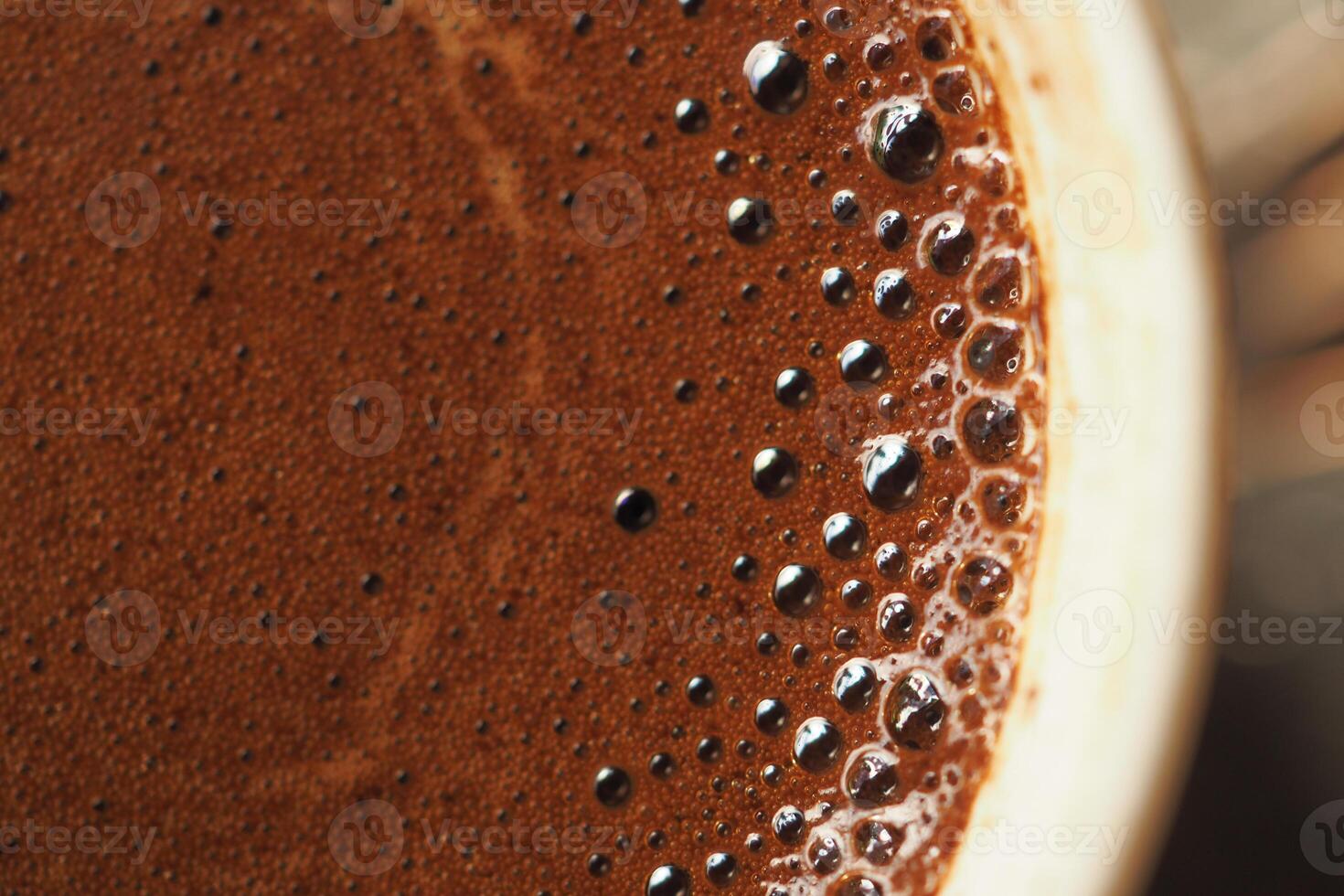 top view of hot coffee with bubble on white background photo