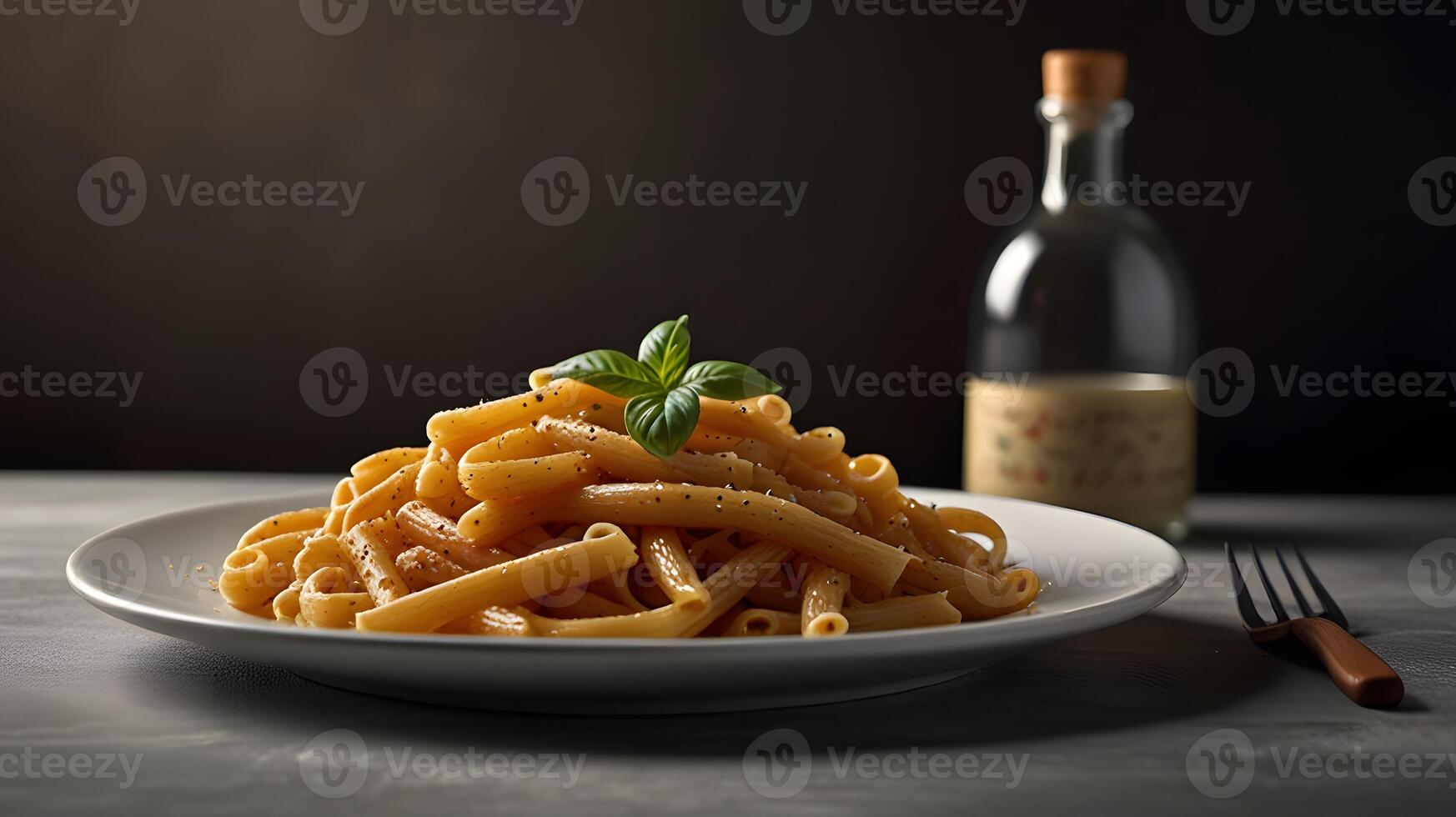 Bucatini pasta served on white plate with fork on the table, tasty appetizing classic italian spaghetti, dark background photo
