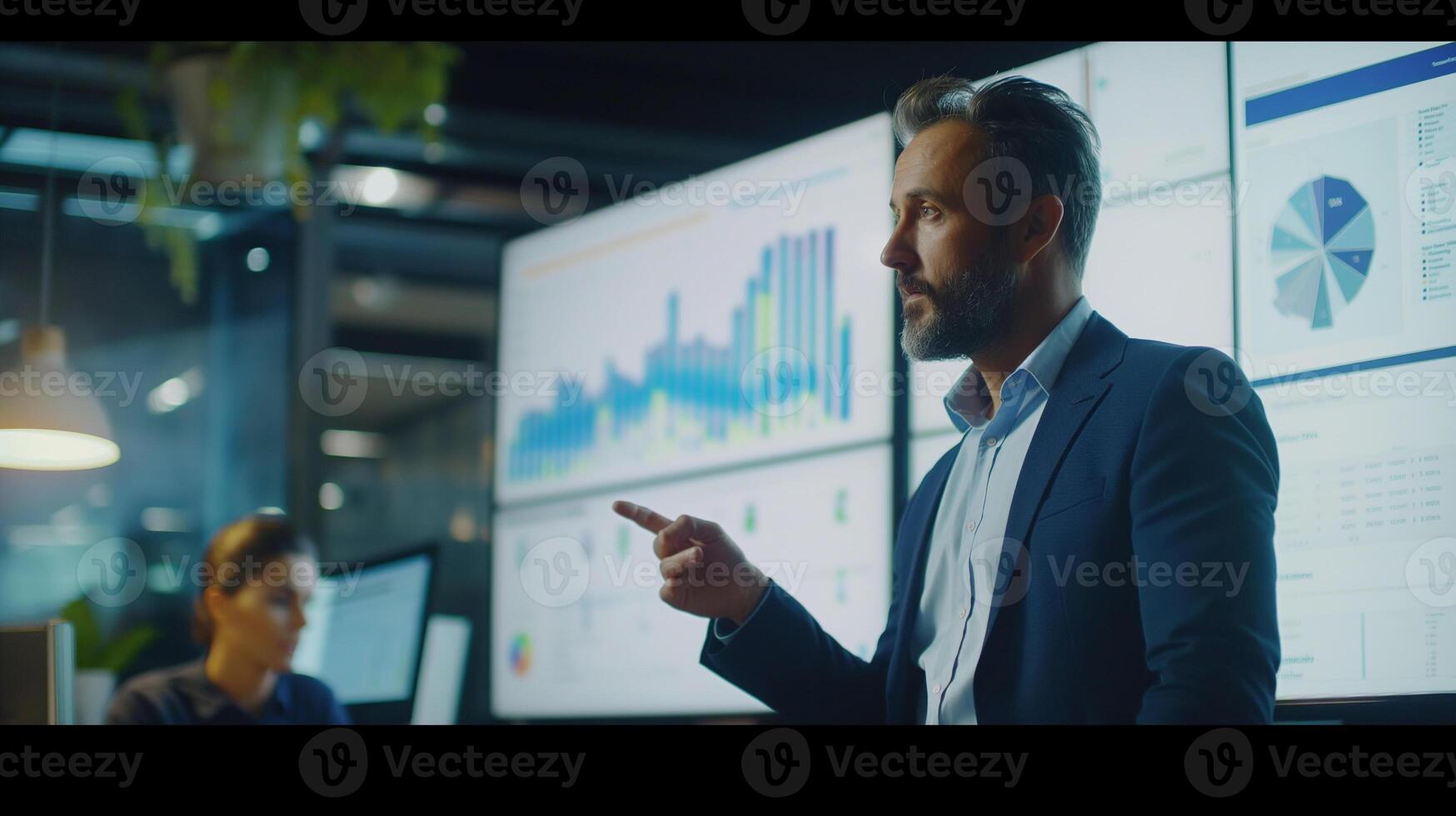 Business meeting concept. Male manager examining sales charts at company meeting. Male employee examining the company's annual report and making a presentation at the meeting. photo