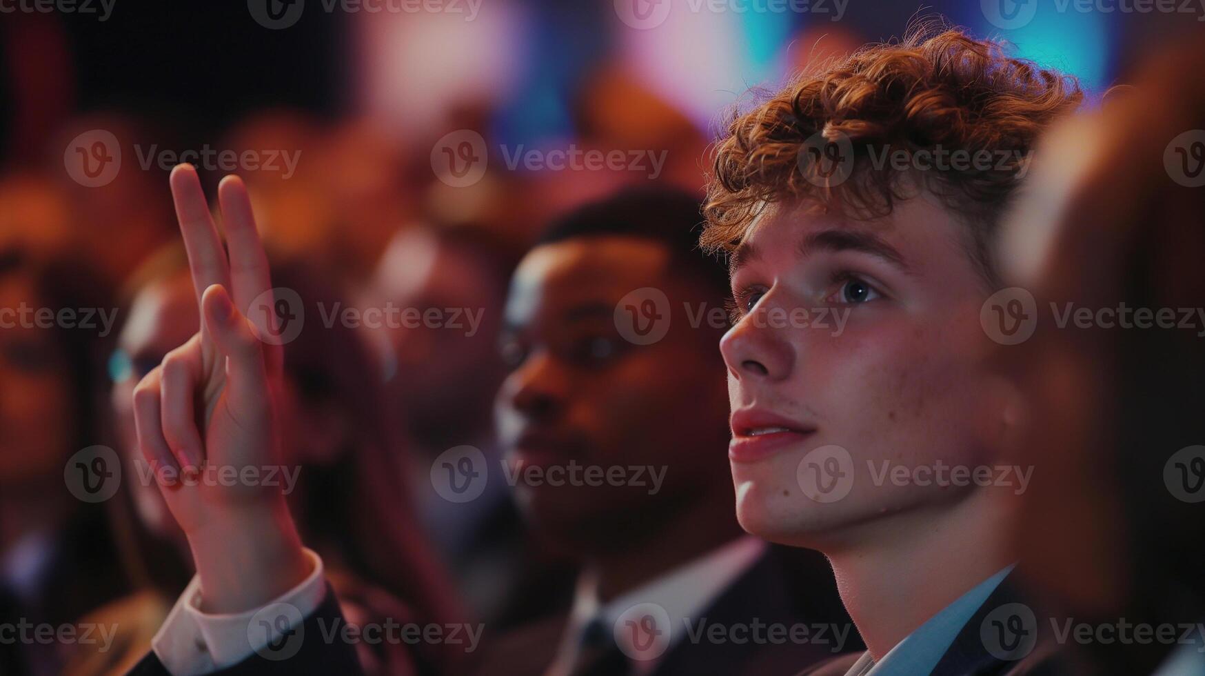 Business concept. Young employee asking to speak at the company's training conference. Young employee speaking at training seminar. photo