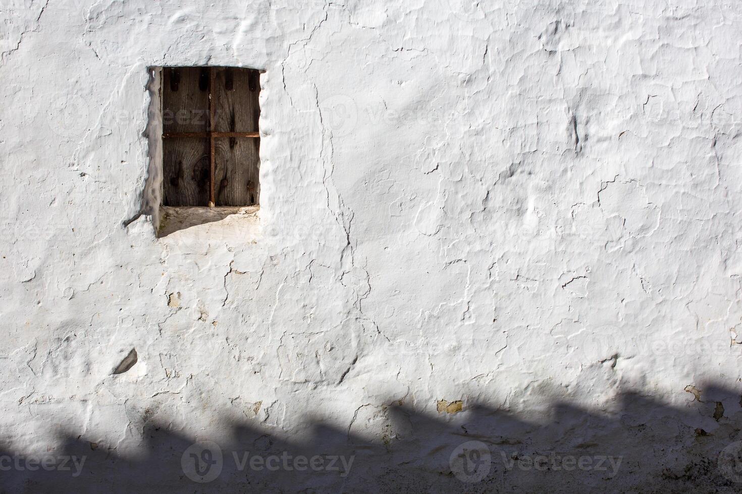 Whitewashed Wall With Window in Afternoon Light, Villaviciosa De Cordoba photo