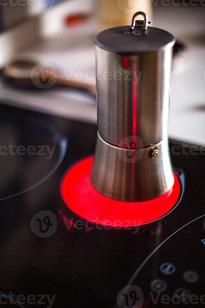Moka Pot on Ceramic Induction Stove Heating Up in Spain, Morning photo