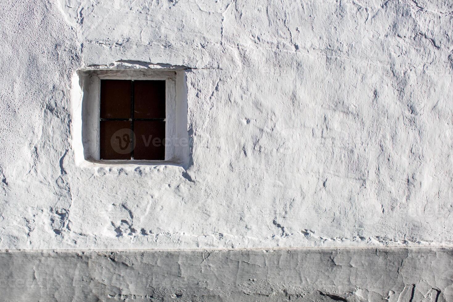 Whitewashed Wall With Window in Afternoon Light, Villaviciosa De Cordoba photo