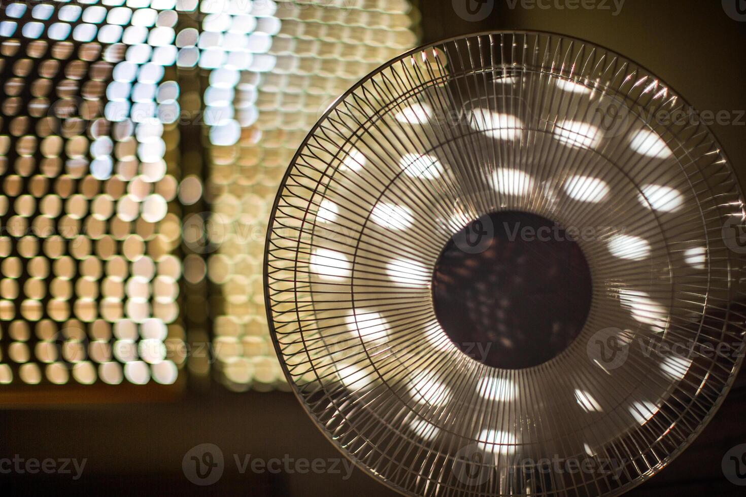 Electric Fan Operating in Cozy Sevilla Room on a Sunny Summer Day photo
