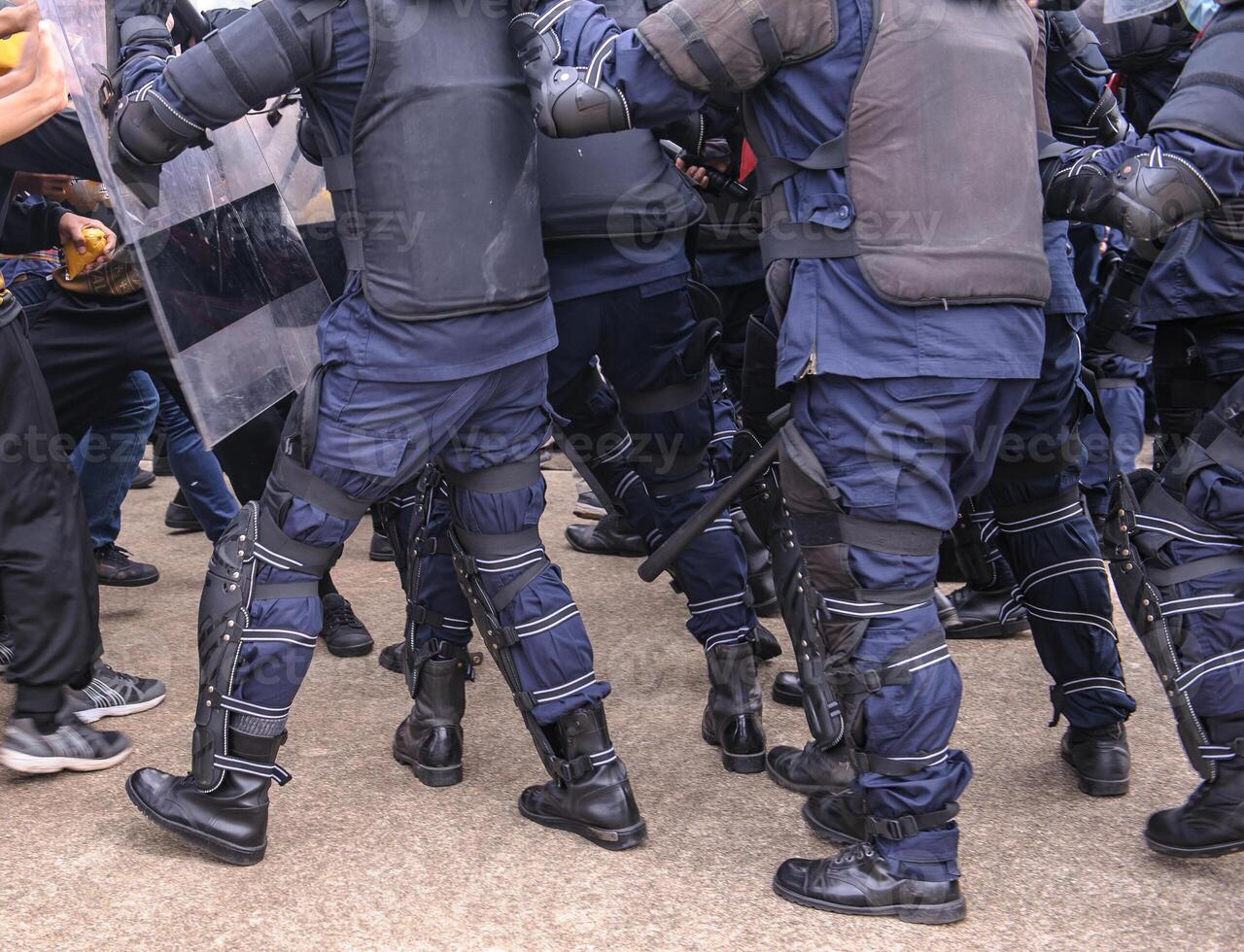 Riot police control the crowd.. photo