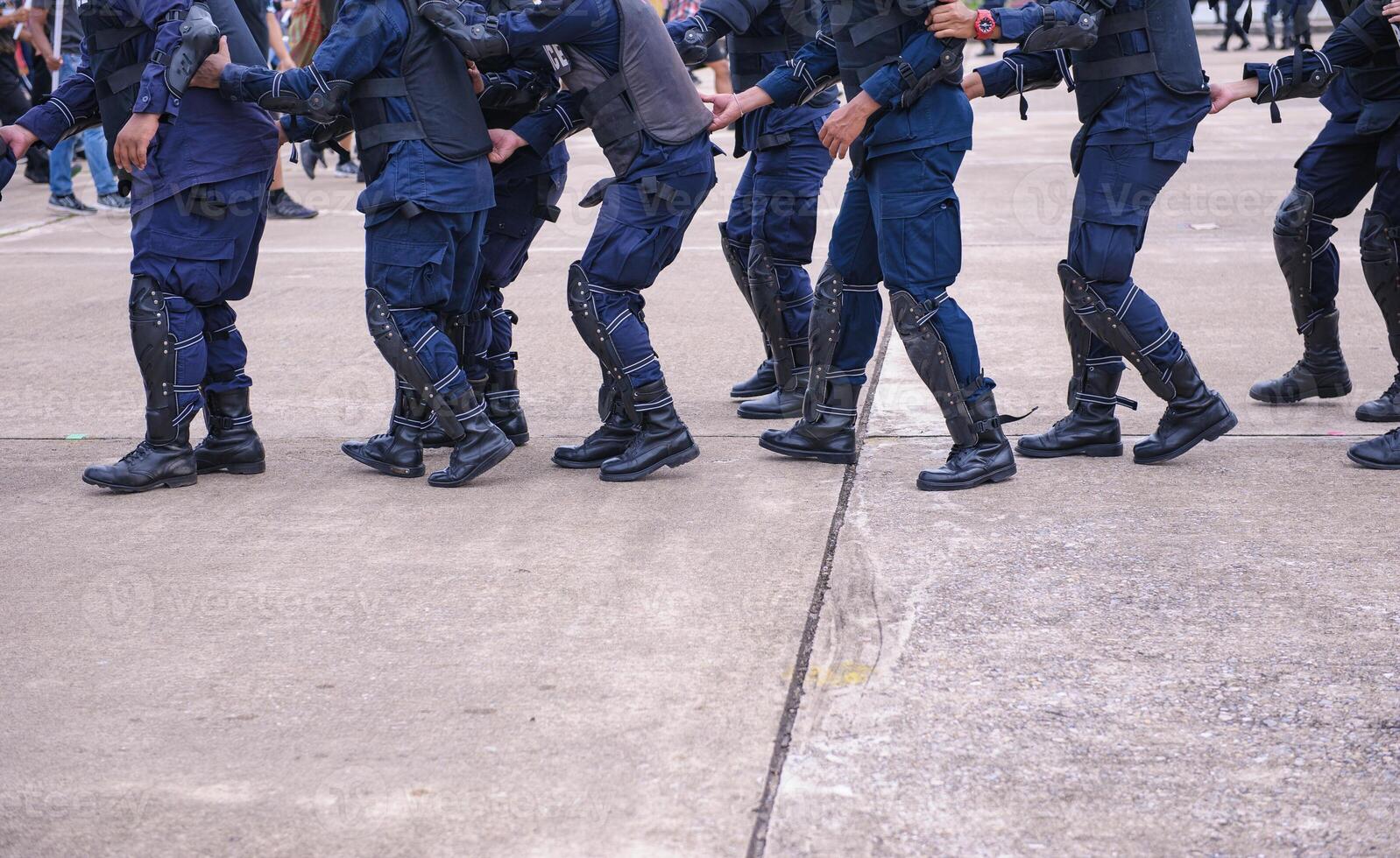 Riot police control the crowd.. photo