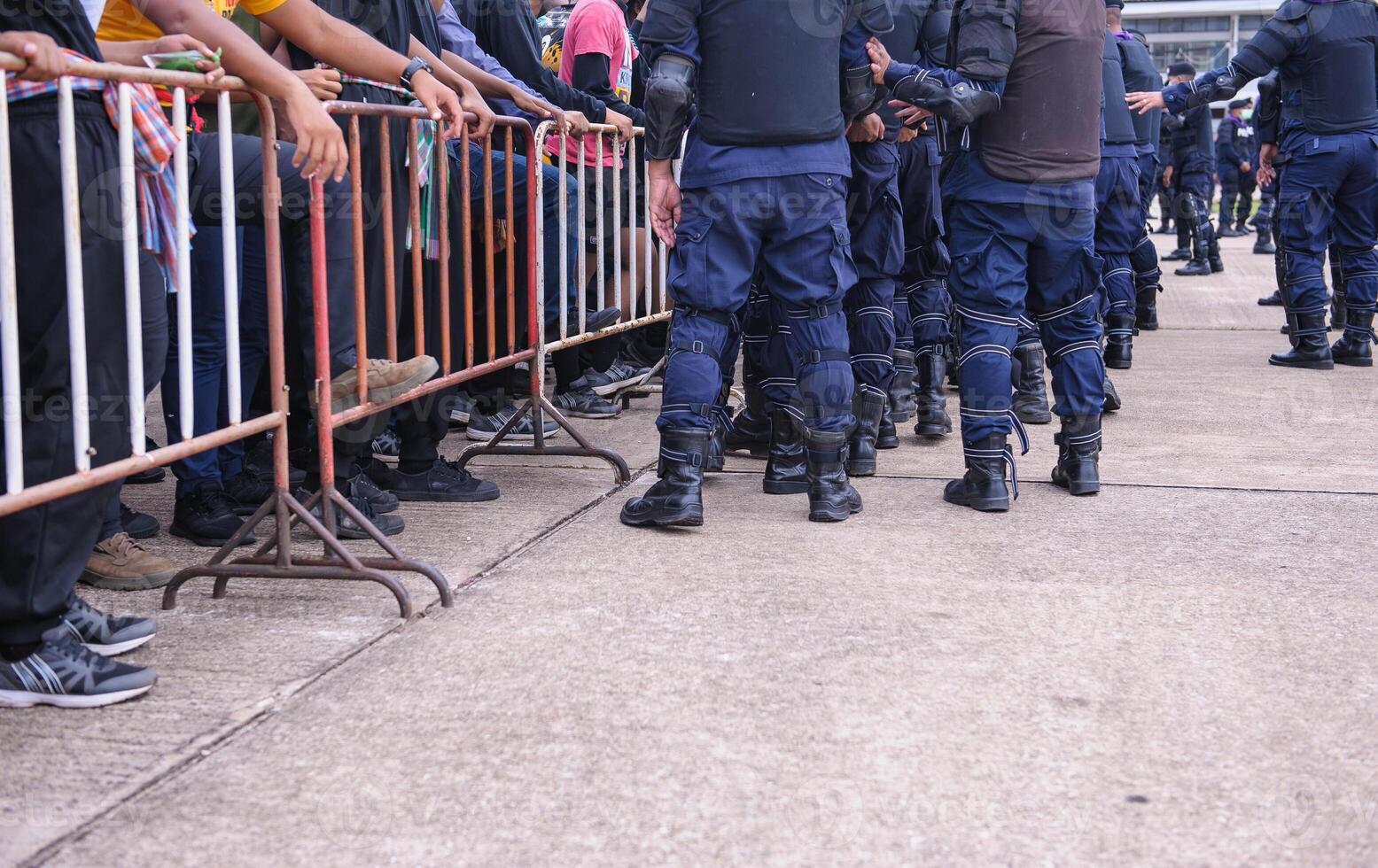 Riot police control the crowd.. photo