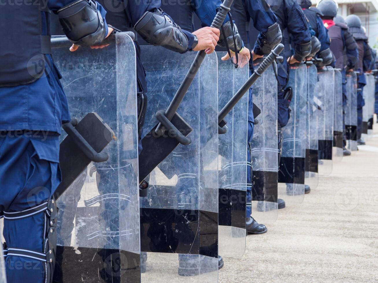 Riot police control the crowd.. photo