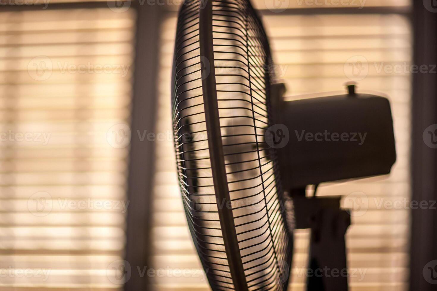 Electric Fan Operating in Cozy Sevilla Room on a Sunny Summer Day photo