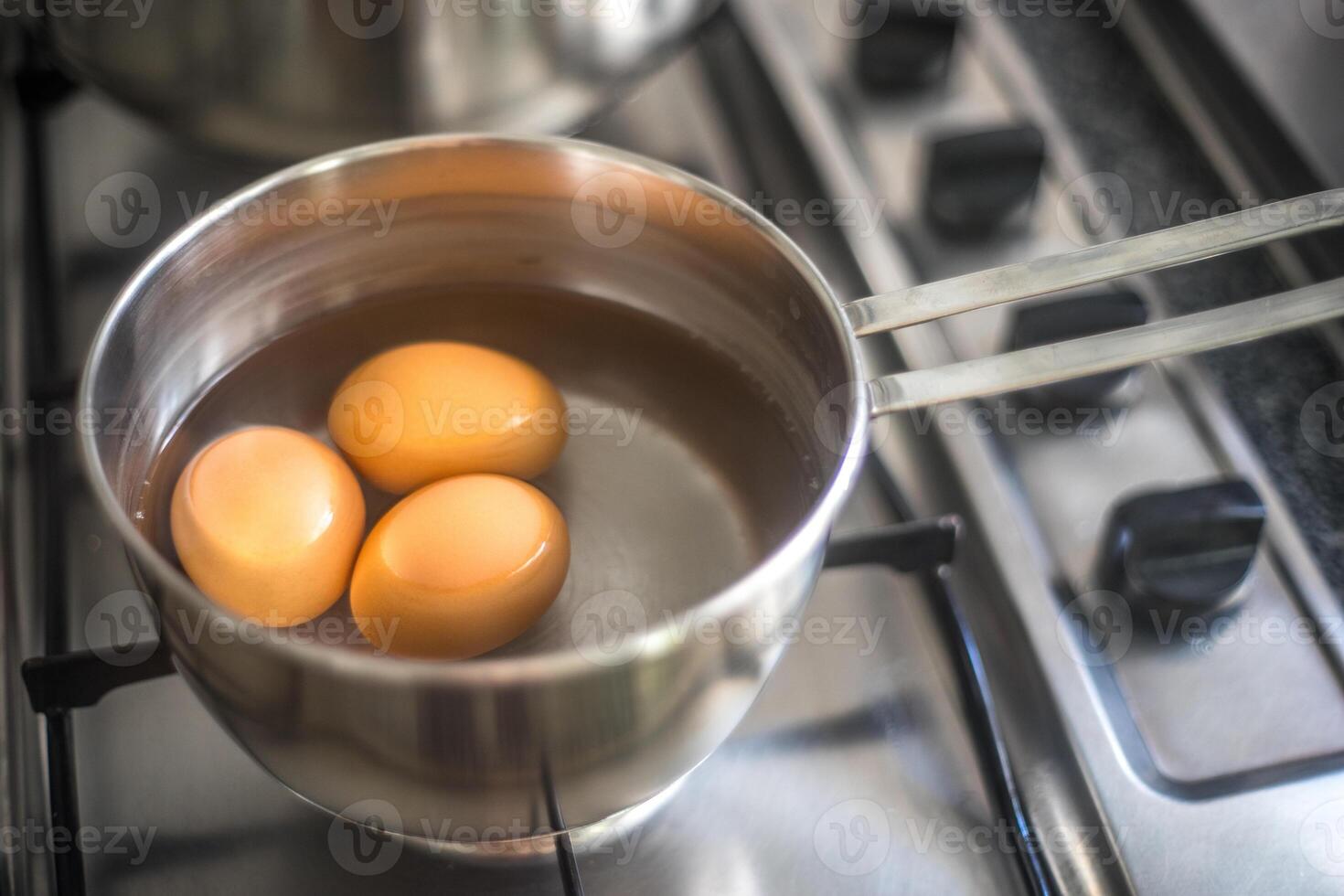 Three Eggs Boiling in Seville photo