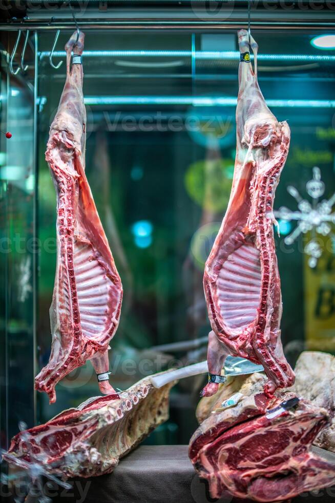 Lamb and Beef Hanging in Seville Butcher Shop photo