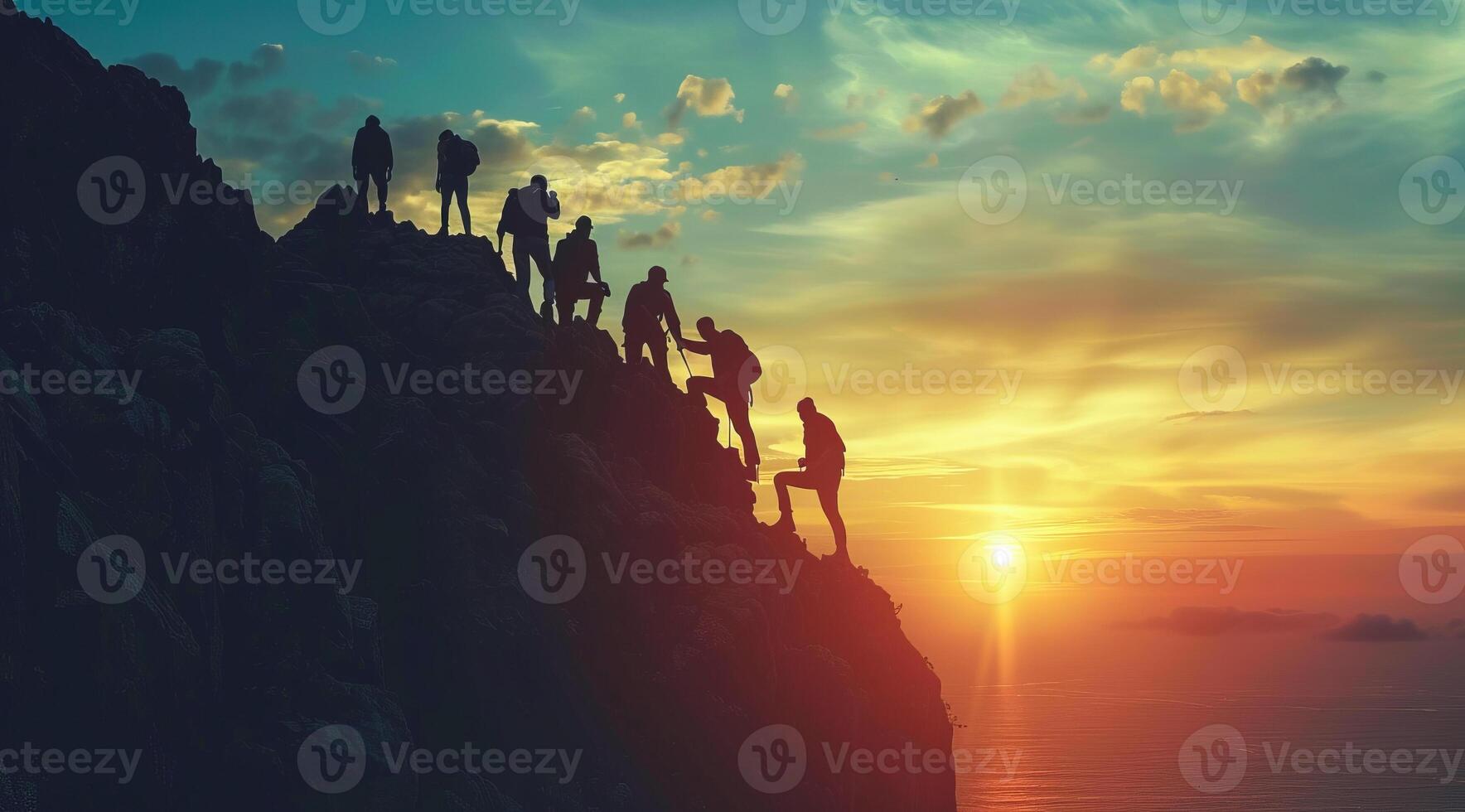 A group of people are hiking up a top of the mountain. Concept of team and business success photo