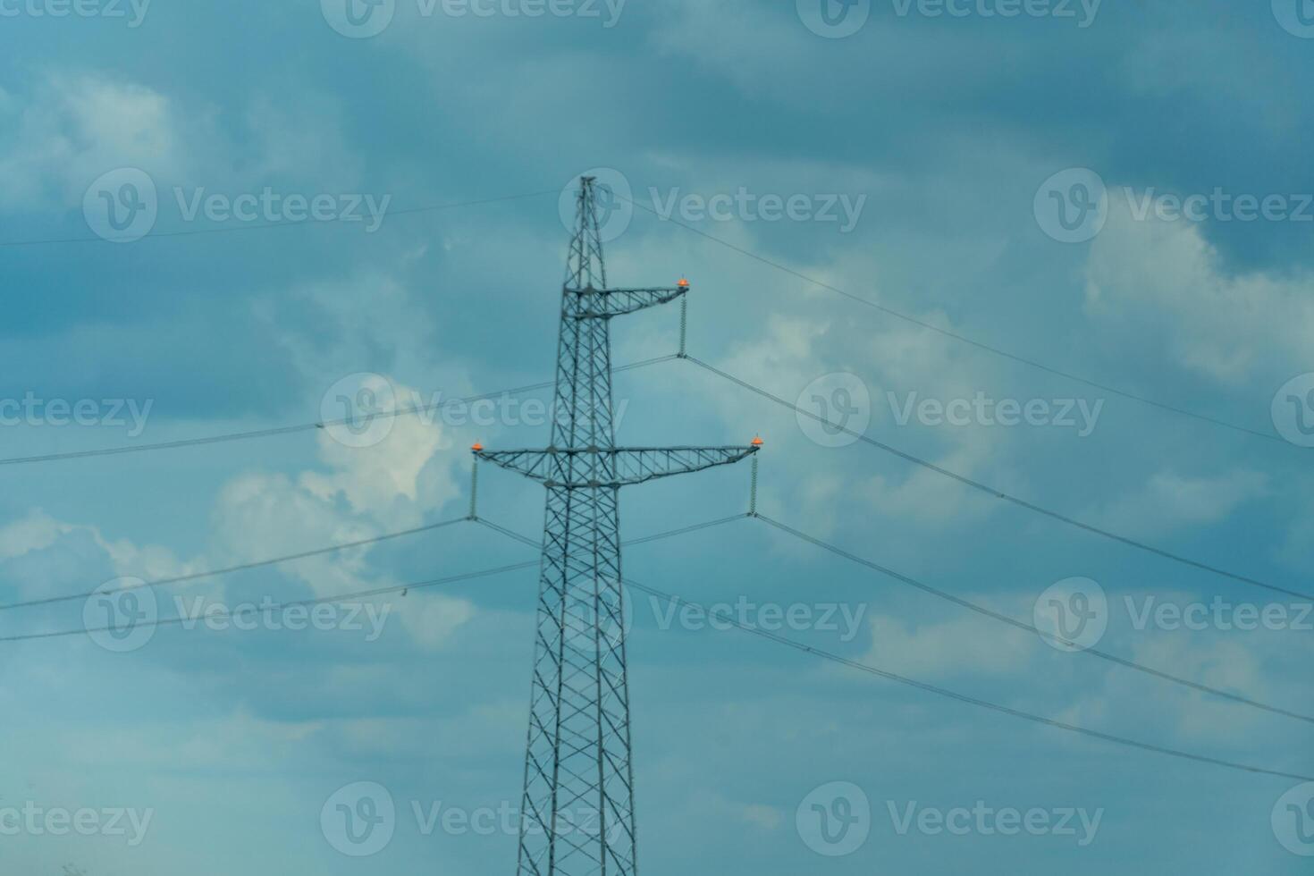 High voltage towers with sky background. Power line support with wires for electricity transmission. High voltage grid tower with wire cable at distribution station. Energy industry, energy saving photo