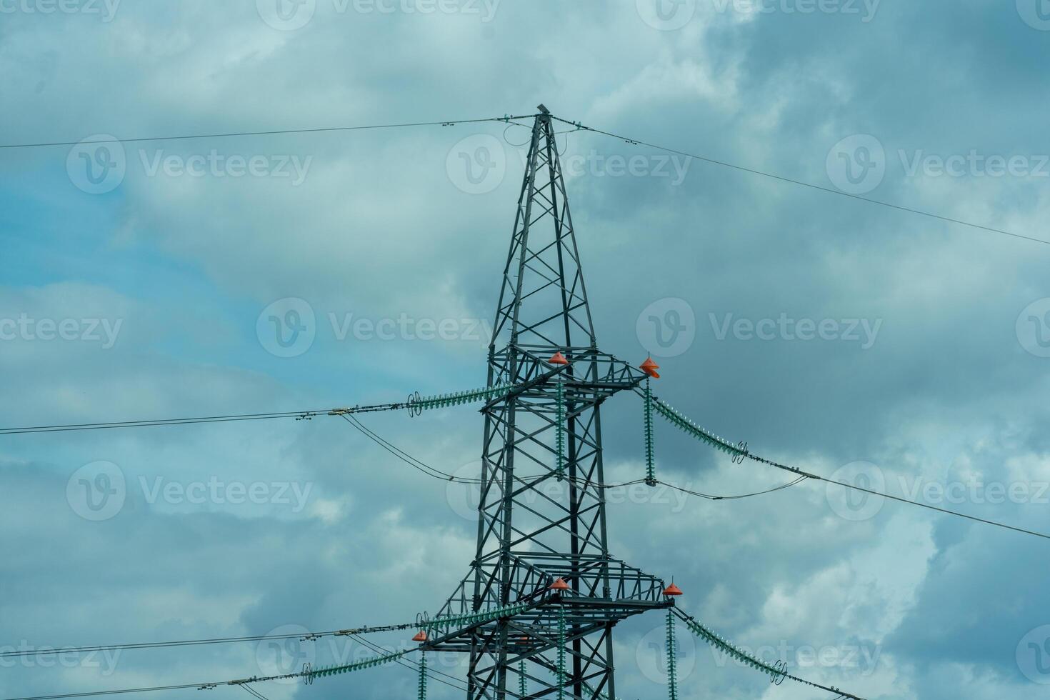 High voltage towers with sky background. Power line support with wires for electricity transmission. High voltage grid tower with wire cable at distribution station. Energy industry, energy saving photo