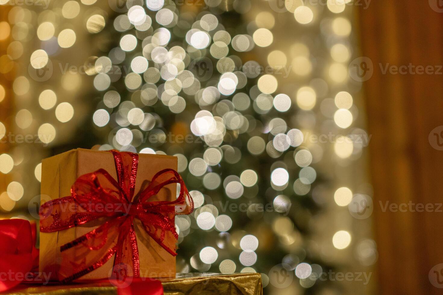 Christmas gift or present box, against magic bokeh background. Beautiful Christmas gift boxes with ribbon photo