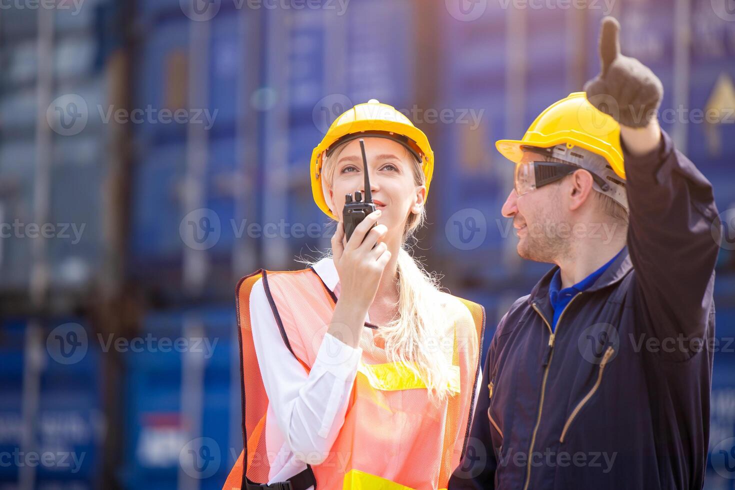 Customs worker team working in Port Cargo Shipping Container Yard together, Radio Loading Control Operate. photo