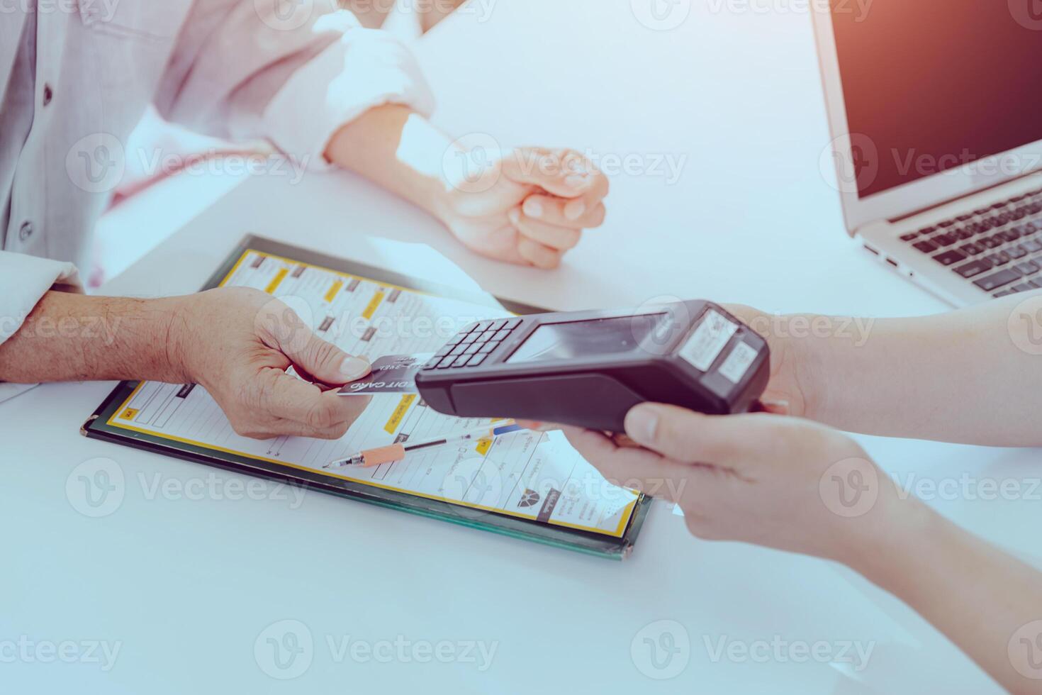 Customer using Credit Card payment with portable Swipe Magnetic Credit Card Reader Terminal machine. photo