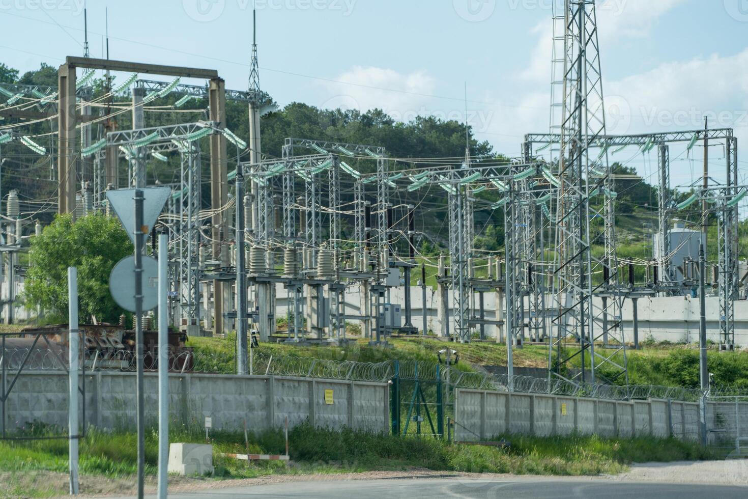 High voltage towers with sky background. Power line support with wires for electricity transmission. High voltage grid tower with wire cable at distribution station. Energy industry, energy saving photo
