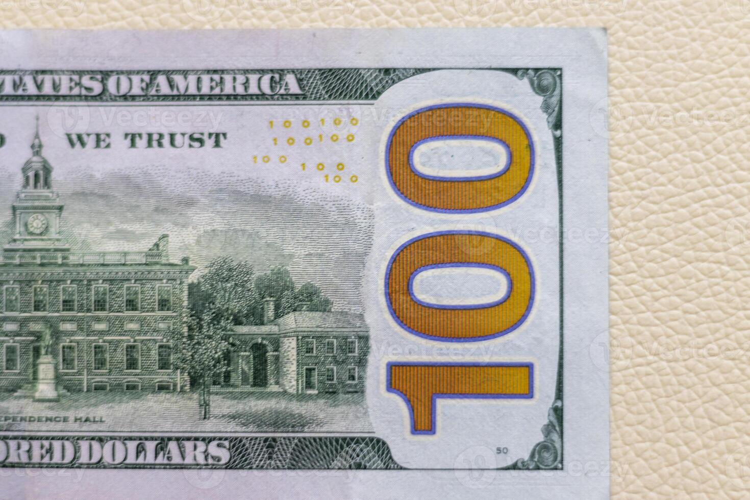 Close up shot of the US dollars note bill on the white leather background. Finance photo