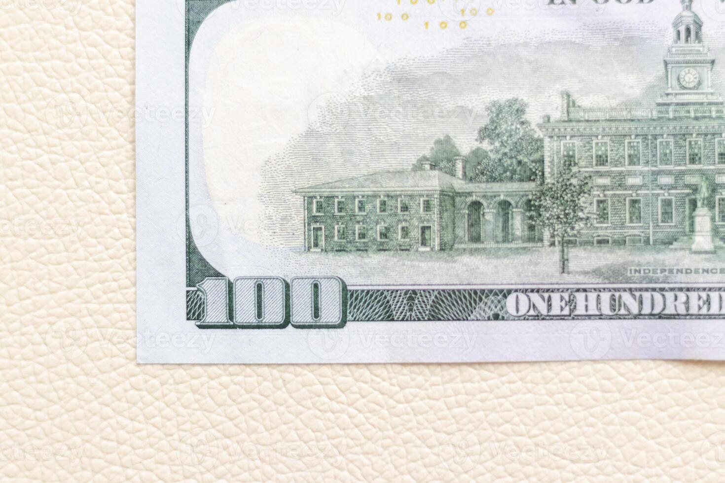 Close up shot of the US dollars note bill on the white leather background. Finance photo