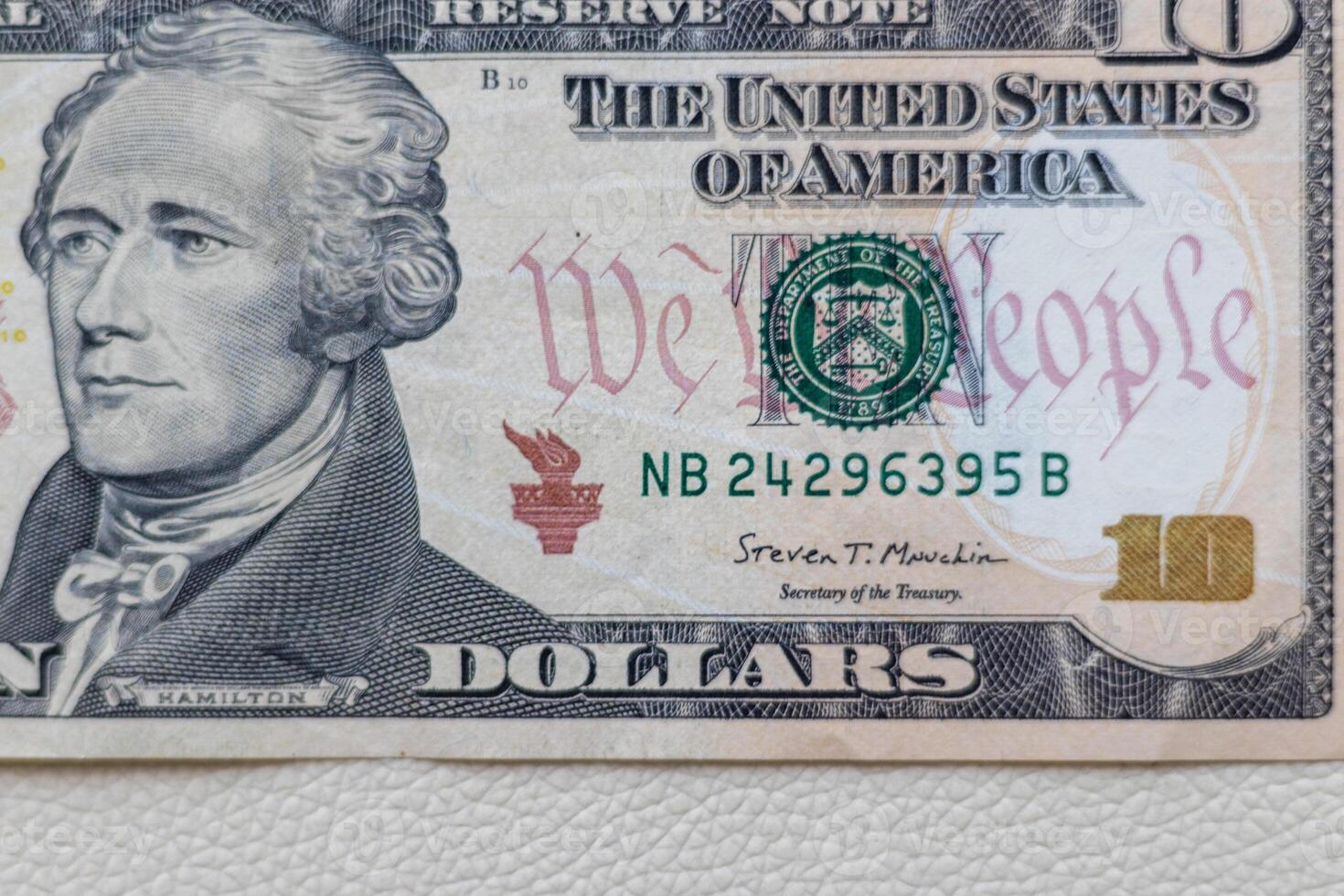 Close up shot of the US dollars note bill on the white leather background. Finance photo