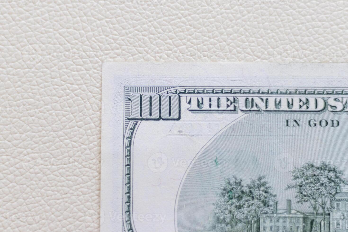 Close up shot of the US dollars note bill on the white leather background. Finance photo
