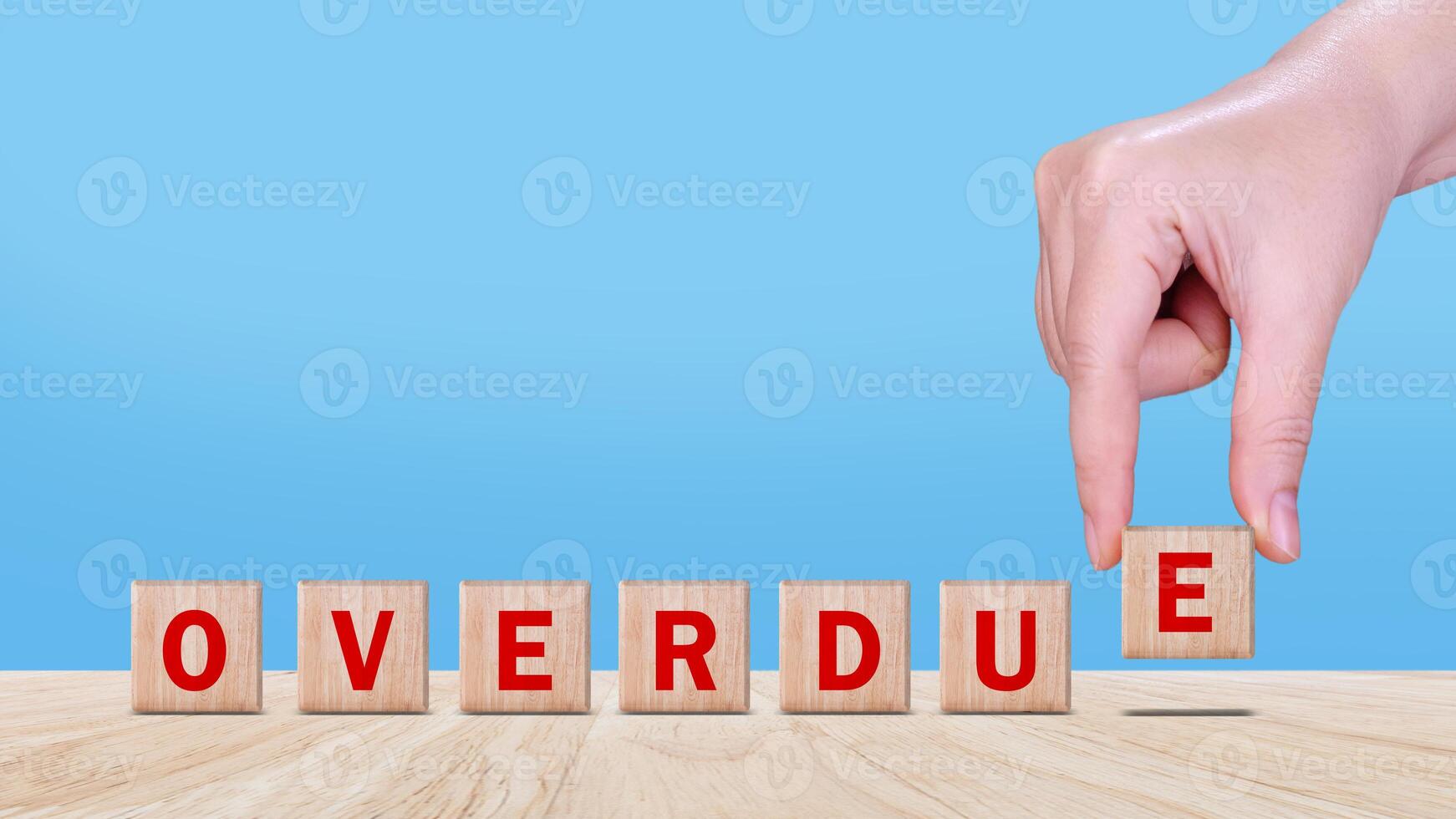 Overdue, Wooden on the office desk, informative and communication background, Word OVERDUE made with wood building blocks, OVERDUE word on block concept. photo
