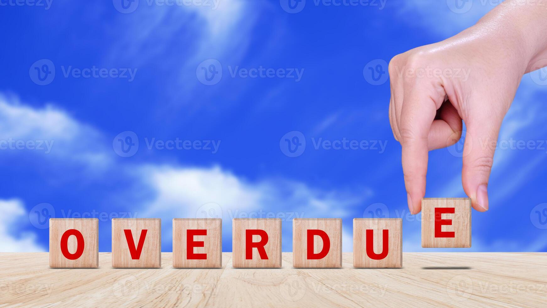 Overdue, Wooden on the office desk, informative and communication background, Word OVERDUE made with wood building blocks, OVERDUE word on block concept. photo