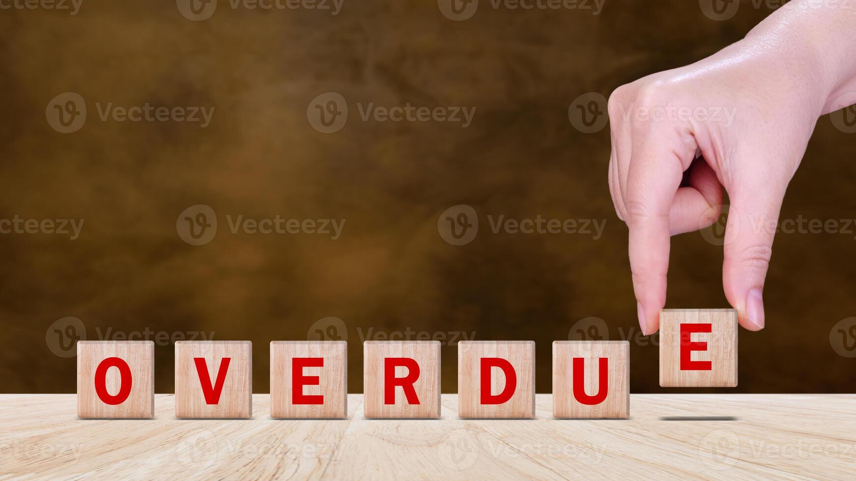 Overdue, Wooden on the office desk, informative and communication background, Word OVERDUE made with wood building blocks, OVERDUE word on block concept. photo