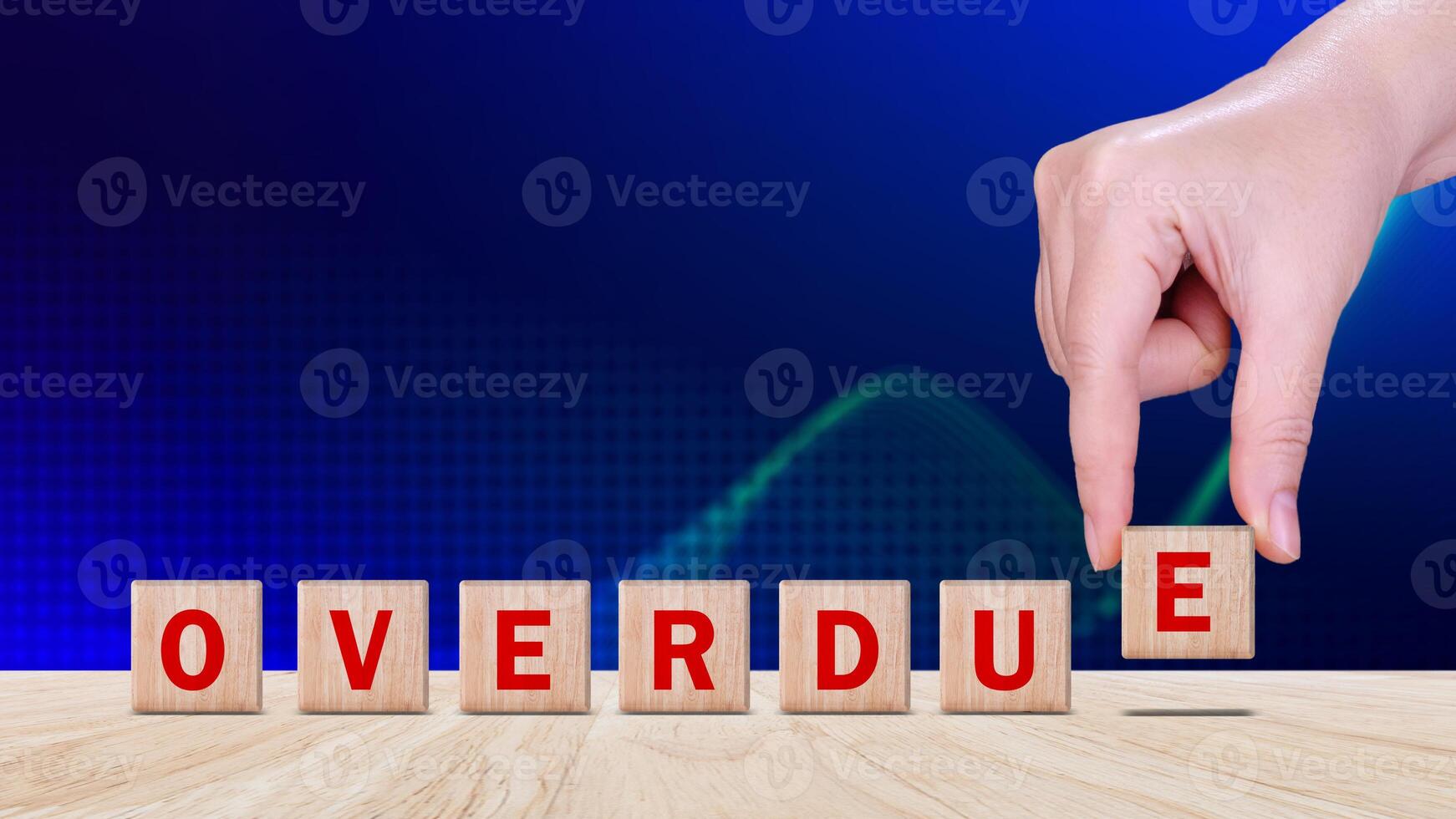 Overdue, Wooden on the office desk, informative and communication background, Word OVERDUE made with wood building blocks, OVERDUE word on block concept. photo
